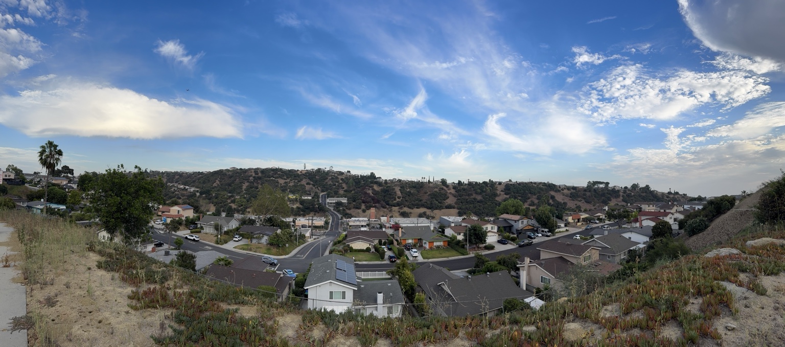 Existing panorama of homes and hillside